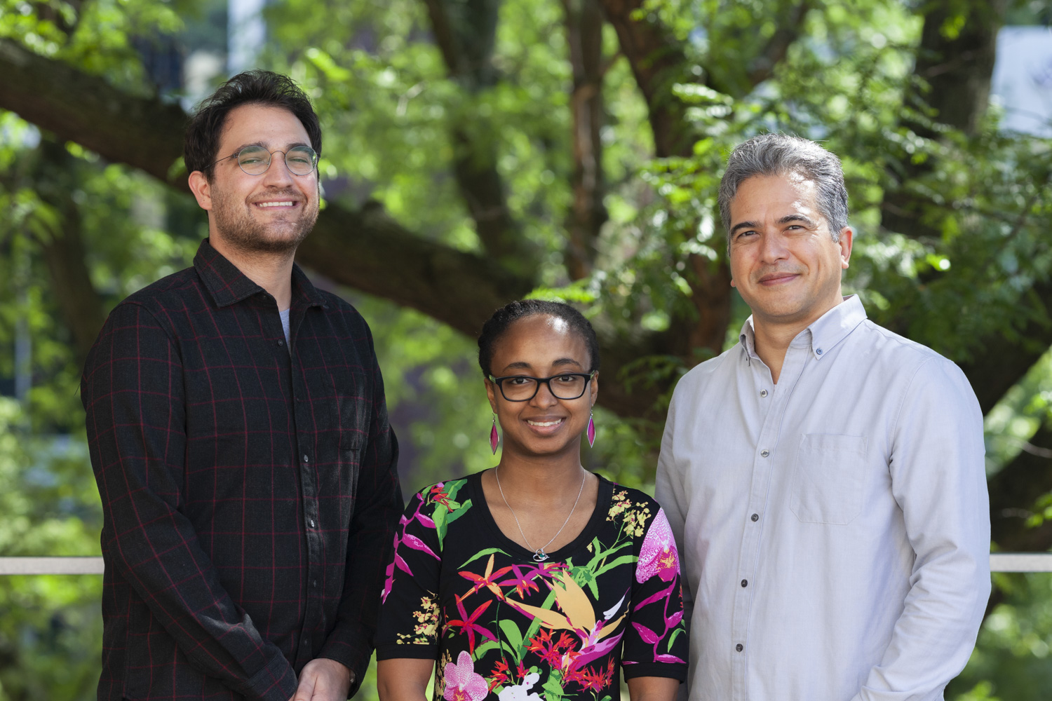 Photograph of three team members.
